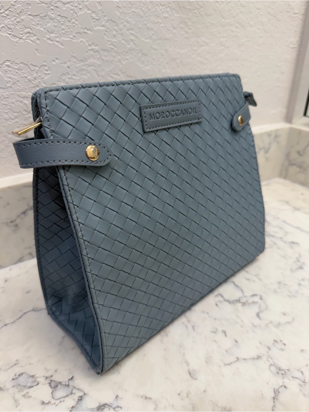 Moroccanoil Woven Sky Blue Cosmetic Case with Gold Accents